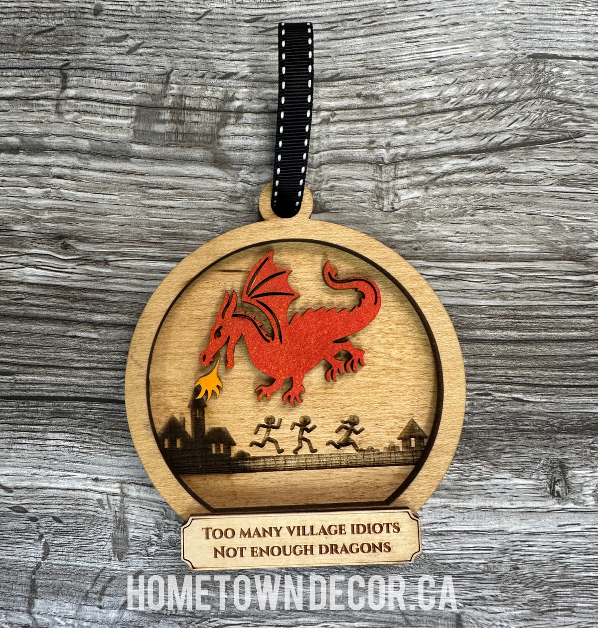 Dragon breathing fire at village idiots Ornament